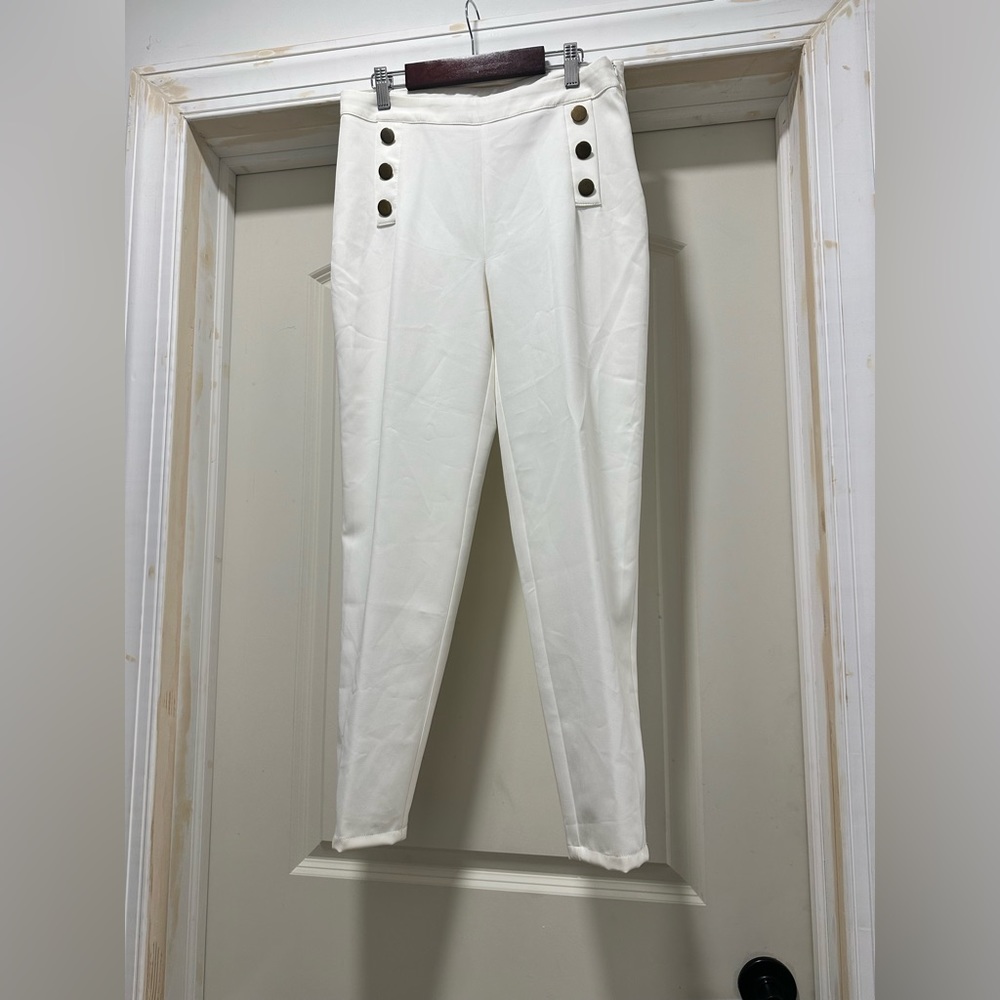 White slacks, with front button detail.